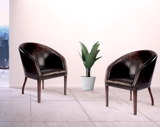 Metro - Modern Curved Armchair Upholstered in a Durable Leather Effect Finish.